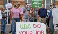 The residents fighting back against traveller land grabs: Villagers descend on council offices to demand eviction from Essex field - days after another site was cleared following protest