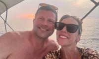 Shirtless Dermot O'Leary poses with his rarely-seen wife Dee Koppang as they enjoy a romantic holiday in Italy