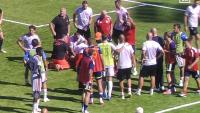Match suspended as player collapses and is carried off on stretcher before being rushed to hospital in worrying scenes