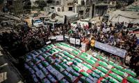 Palestinians in Gaza bury 100 recovered from rubble, including dozens of children
