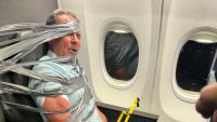Businessman fired after 'racist biting rampage' sees him duct-taped to plane seat