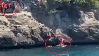 Moment migrants clamber onto rocks and swim to shore after arriving on packed tourist beach in Spain on speedboat ‘taxi’
