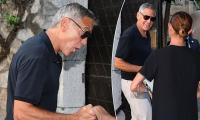 The George Clooney effect! Silver fox star, 65, charms giddy fan as he arrives for presidential dinner
