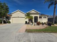 Live the Florida lifestyle at this Suncoast Lakes home