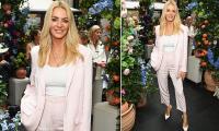 Tess Daly ditches her wedding ring as she returns to London after French holiday with estranged husband Vernon Kay and their daughters