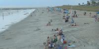 Sun, rain and jellyfish: Beachgoers brave mixed weather on Tybee Island for Labor Day
