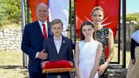 Princess Charlene steps out with her family in a black dress reminiscent of one Queen Letizia wore a decade ago