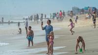 Visitors soak up sun at Rehoboth Beach on Labor Day