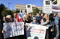Analysis: Seven years after crisis, Lebanon's banks struggle to survive