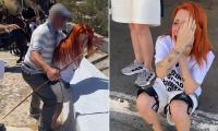 Moment enraged donkey owner attacks activist after she vowed to 'defend' animals being used to transport tourists in Santorini