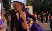Brooklyn Beckham proves himself to be the perfect assistant as he dutifully carries wife Nicola Peltz's couture Balenciaga gown at the Venice Film Festival