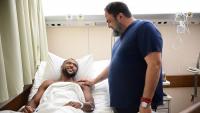 Nottingham Forest owner Evangelos Marinakis visits stricken Olympiacos star in hospital after injury left him in tears