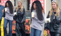 Heidi Klum's daughter Lou, 16, is the SAME height as her as the duo brave the rain in Los Angeles
