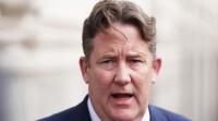 Minister faces budget battle over carbon tax delay