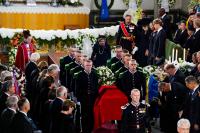 With large crowds attending, Norway lays King Harald to rest