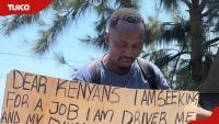 Kenyan man carries placard on street to plead for driver’s job: “My daughter and I are suffering”