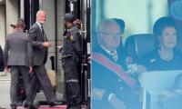 Not their usual style: Europe's royal families are loaded on to a bus from Oslo Airport for the funeral of Norway's Harald V - while Spain's King Felipe carries his own bag
