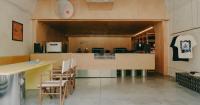 plywood and reflective steel build retro-futurist print shop in tbilisi’s former factory