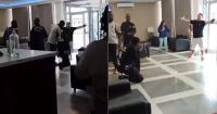Deported Cuban stands between armed police and threatened migrant in Equatorial Guinea