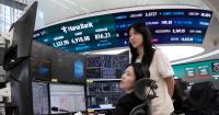 Asian shares fall and oil prices trade above $100 a barrel