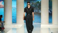 Men’s clutch bags are everywhere, and fashion’s latest status symbol is anything but practical