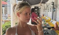 Lottie Moss goes make-up free as she takes a selfie in a silver string bikini on girls' holiday