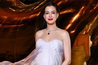 Anne Hathaway Brings Her Maternity Style to New York Fashion Week in Glamorous Gown and Sparkling Jewels