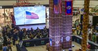 Twin Towers replica stands illuminated, representing unity, resilience, remembrance