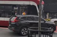 Toronto driver hits streetcar after turning into transit lane, reigniting bike-lane fight
