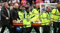 UK football match halted after player goes down with nobody near him as medics rush on
