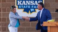 Ty Masterson and Cindy Holscher debate at Kansas State Fair