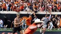 Oklahoma State fans storm field, throw goalpost into Theta Pond after upset win over Oregon