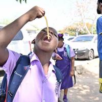 Selling sweets, serving children