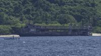 Philippine rescuers pull victims from charred ferry