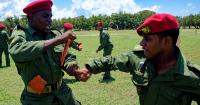 The "red berets" promise to defend a "prosperous socialism" while the regime embraces market measures