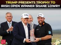 Trump presents Irish open trophy to Shane Lowry after record-breaking win