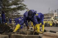 Ex-gang members sweep Kinshasa clean, but locals fear their sticks