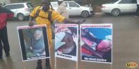 Election violence victims protest outside Masaka High Court