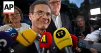 Swedish PM says preliminary election results are extremely close