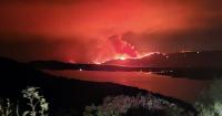 Horror as British tourists jump into sea to escape holiday island engulfed by inferno