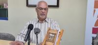 Program featuring the presentation of the book “willem rasmijn, the story of his life and the aruban gold rush” at the national library of aruba, oranjestad