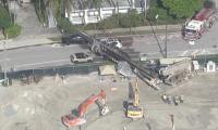 4 injured after construction rig collapses onto street in Miami