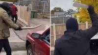 Masked traveller gang smash up rival clan's cars with crowbars and poles as feud rages on
