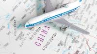 China says new exit and entry regulations will not affect ordinary travellers