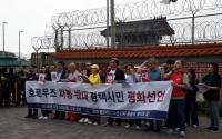 South Korean activists protest potential Hormuz deployment outside Camp Humphreys