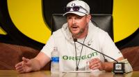 Oregon's Lanning offers testy defense of QB Moore