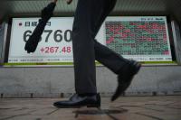 Asian shares trade mostly lower after AI stocks sink