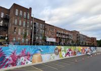 Meet The Four Seasons of Oneonta With A Massive Mural On Market Street