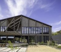 Tour a Chilean holiday home designed to weave daily life into its lakeside site