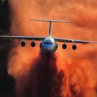 Four-engine jets bomb Highland Industrial Park blaze with fire retardant